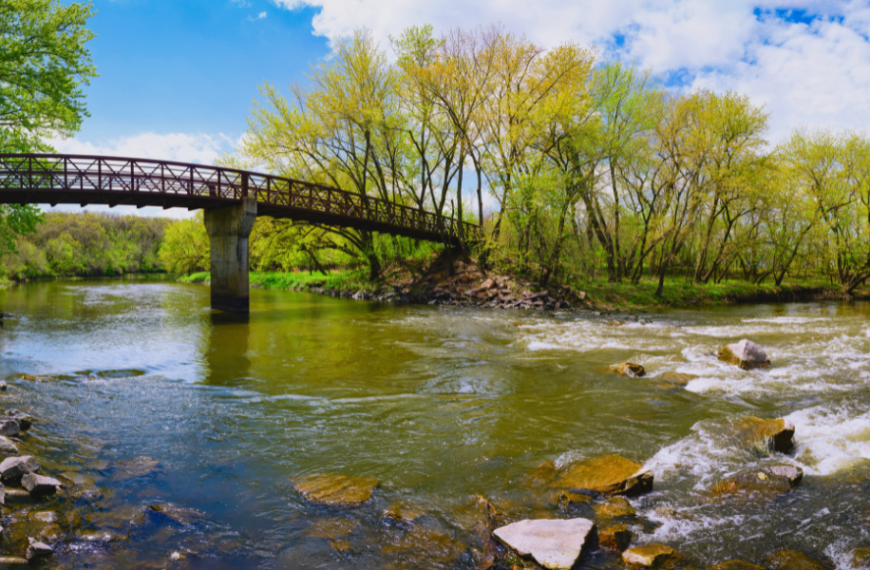 Picture depicts a bridge going over the Big Sioux River in Sioux Falls, SD