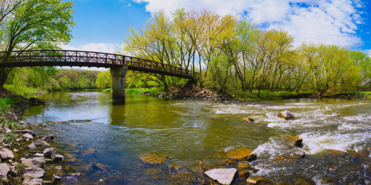 Picture depicts a bridge going over the Big Sioux River in Sioux Falls, SD