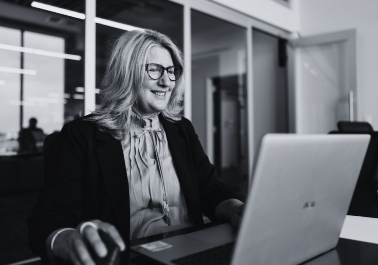 Business employee working on a laptop in a modern office