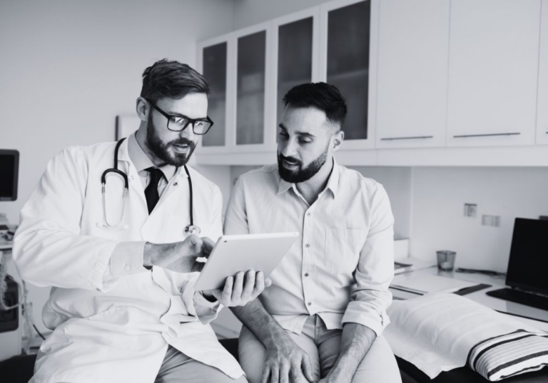 Healthcare professionals reviewing information together on a tablet