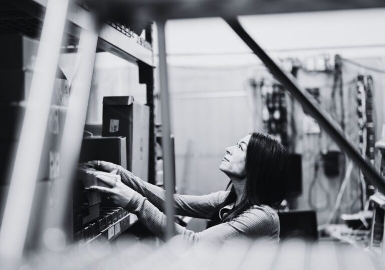 Team member working with equipment in a technical environment to support business operations.