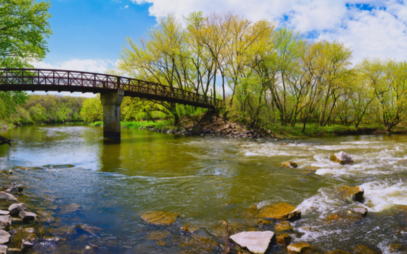 Picture depicts a bridge going over the Big Sioux River in Sioux Falls, SD