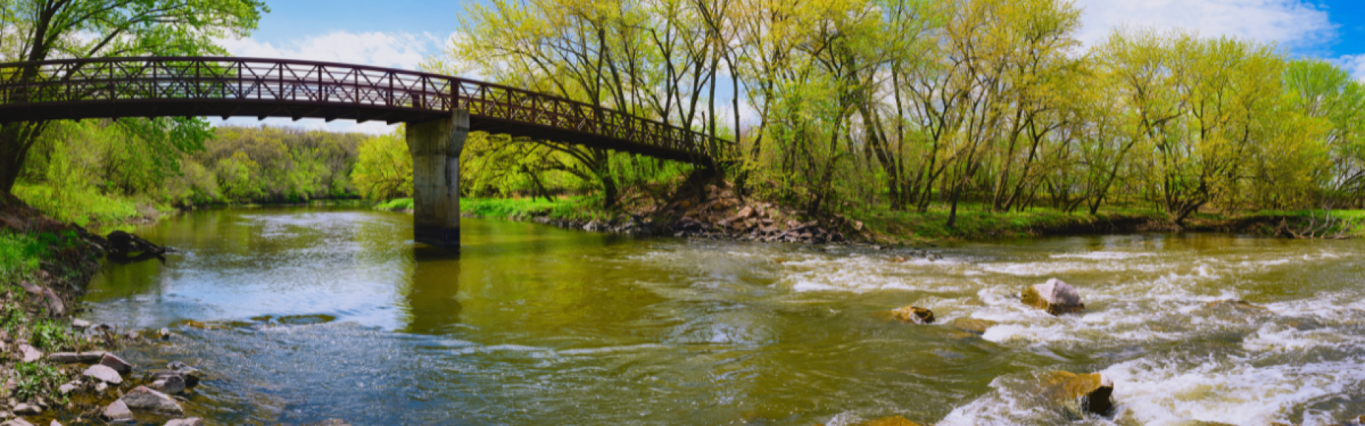 Picture depicts a bridge going over the Big Sioux River in Sioux Falls, SD